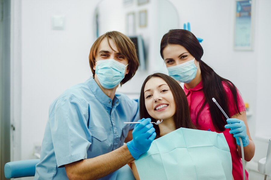 happy-dentists-with-patient