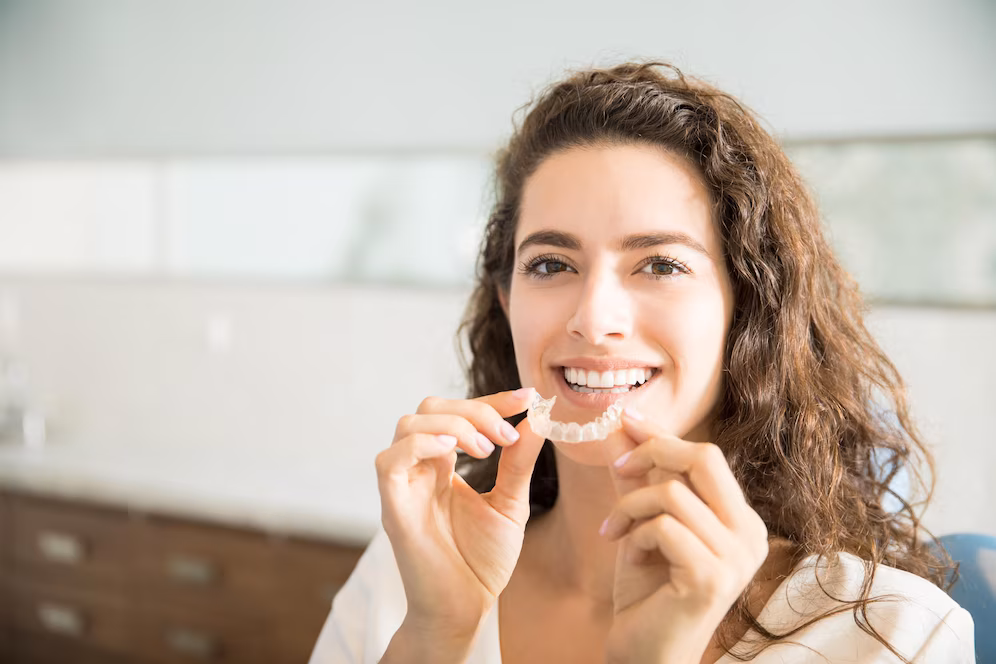 girl holding braces